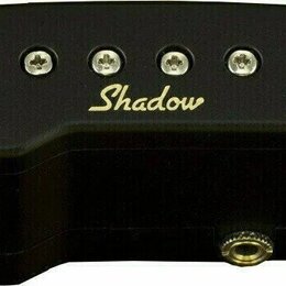 Černý plastový snímač s nápisem Shadow v bílo-zlaté barvě. Na levé straně je umístěn posuvný regulátor s nápisem VOLUME. Horní hranu tvoří řada osmi…