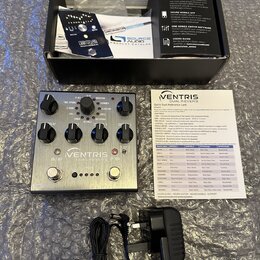 Stříbrný efekt pedál s nápisem VENTRIS DUAL REVERBS. Na horní straně jsou čtyři ovládací knoflíky, dva přepínače a několik přepínacích switchů. K ped…