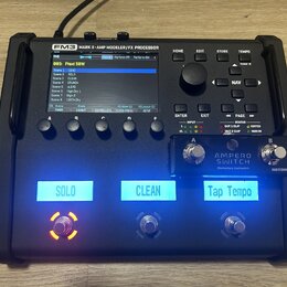 Černý kytarový procesor s nápisem FM3 MARK II - AMP MODELER/FX PROCESSOR. Zařízení má displej, několik ovládacích tlačítek a jeden velký otočný knofl…