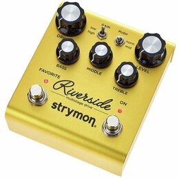 Zlatý kytarový efekt s nápisy Riverside multistage drive a strymon. Pedál má pět černých ovládacích knoflíků s bílými vršekmi a popisky DRIVE, BASS,…