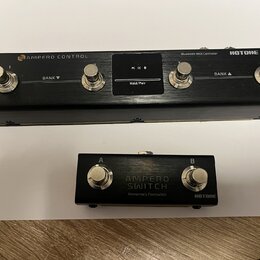 Na fotografii jsou dvě černé kovové zařízení značky HOTOHE. Horní je Bluetooth MIDI Controller s nápisem AMPERO CONTROL, čtyřmi stomačními spínači oz…