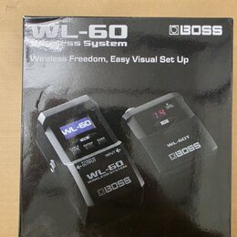 Fotografie krabice od bezdrátového systému značky BOSS s označením WL-60. Na obalu je nápis Wireless Freedom, Easy Visual Set Up a obrázky vysílače i…
