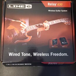 Krabice s nápisem LINE 6 a Relay G30 Wireless Guitar System. Na balení je fotografie kytary a dvou komponentů s popisky TBP06 Transmitter a RXS06 Rec…