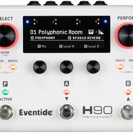 Bílý efektový procesor s nápisy Eventide, H90 a Harmonizer®. Zařízení má dva velké červeně vyznačené ovraty s popisky SELECT (BANK hold) a PERFORM, t…