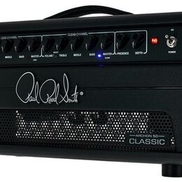 Černý kytarový zesilovač s nápisem Paul Reed Smith uprostřed přední strany. V horní části jsou ovládací knofíky rozdělené na sekce LEAD CHANNEL a CLE…