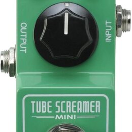 Zelený kytarový efekt s nápisy TUBE SCREAMER MINI a Ibanez. Na horní straně jsou dva černé otočné ovladače s popisky TONE a LEVEL, červená kontrolka…