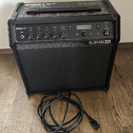 Černý kytarový kombozesilovač značky LINE 6. Na horní části je nápis SPIDER V 30 MkII a text 30-WATT GUITAR AMP, vpravo nápis PLAY MORE. Přední panel…