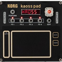 Černý efektový procesor s nápisy KORG a kaoss pad. Zařízení obsahuje čtyři přepínače označené FX 1, FX 2, FX 3 a FX 4 s červenými kontrolkami, jeden…