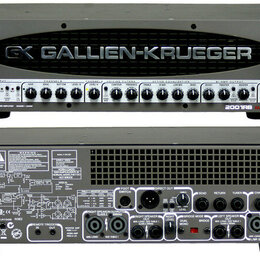 Fotografie znázorňuje basový zesilovač značky GALLIEN-KRUEGER s označením GX. Přední panel je stříbrný s ovládacími prvky a nápisy jako CHANNEL B, CH…