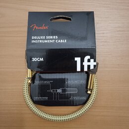 Kabel pro hudební nástroje značky Fender, model DELUXE SERIES INSTRUMENT CABLE. Kabel má délku 30CM (1ft) a je potažen světlým pleteným materiálem. J…