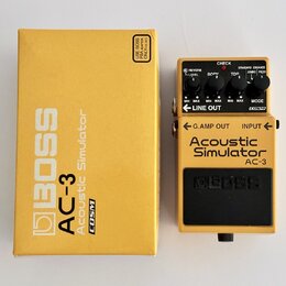 Žlutý efekt pedál Boss AC-3 Acoustic Simulator v originální žluté krabici. Na pedálu jsou čtyři ovládací knoflíky s nápisy REVERB LEVEL, BODY, TOP a…