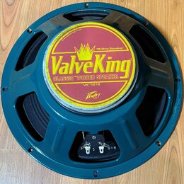Kruhový reproduktor s modrým kovovým rámem. Na středovém krytu je žlutá nálepka s nápisy ValveKing, CLASSIC™ VOICED SPEAKER, 16 Ohm Speaker a VK™1216…
