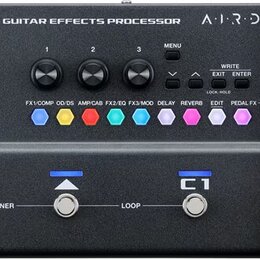 Černý kytarový procesor s nápisem BOSS GX-1 GUITAR EFFECTS PROCESSOR a logem AIRD. Zařízení má displej, tři otočné ovladače, několik tlačítek s barev…