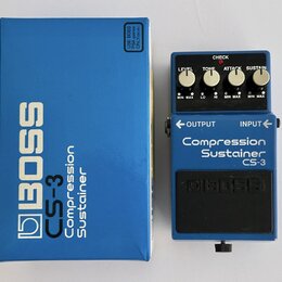 Modrý kytarový pedál s nápisem Compression Sustainer CS-3 a logem BOSS. Efekt má čtyři ovládací knoflíky označené LEVEL, TONE, ATTACK a SUSTAIN, červ…