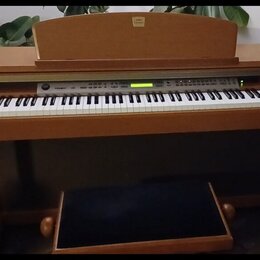 Digitální piano v dřevěné barvě s bílými a černými klávesami. Na horní části je nápis Yamaha. Nástroj má ovládací panel s tlačítky a malým displejem,…