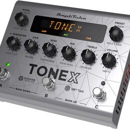 Stříbrný kytarový procesor s nápisem TONEX a logem AmpliTube. Zařízení má pět otočných ovladačů s popisy GAIN, BASS, MID, TREBLE a VOLUME, displej s…