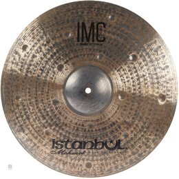 Bronzový činel s tmavým, kropkovaným povrchem a viditelnými hámrnými důlky. Na horní části je nápis IMC BRONZE DARK 18" CRASH a v dolní části logo is…