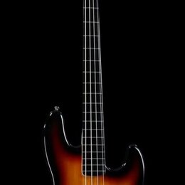 Čtyřstrunná elektrická basová kytara s tělem v provedení sunburst. Na hlavě hředu je viditelné logo Fender a nápis Jazz Bass. Nástroj má světlou hmat…