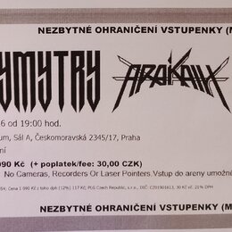 Fotografie vstupenky na koncert s nápisy DYMYTRY a ARAKAIN. Je zde uveden text BEST ROCK uvádí, TOUR neztrácíme náboj znovu po 10 letech a datum 23.1…