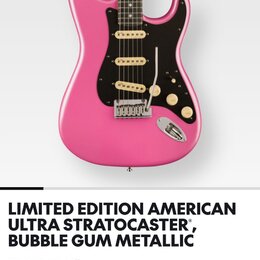 Snímek zachycuje růžovou elektrickou kytaru typu Stratocaster s černým pickguardem a zlatými prvky. Pod nástrojem je text LIMITED EDITION AMERICAN UL…