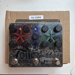 Stříbrný efektový pedál s nápisem electro-harmonix a MULTI EFFECT. Zařízení obsahuje tři sekce označené jako MEMORY TOY, NEO CLONE a METAL MUFF, s od…