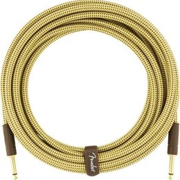 Zvitý instrumentální kabel s pleteným obalem v žluté barvě. Na hnědé koženkové stahovací pásce je bílý nápis Fender. Kabel má na koncích hnědé konekt…