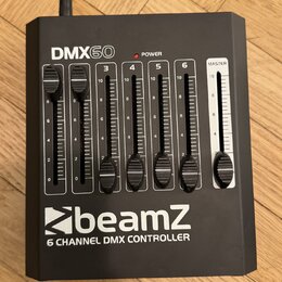 Černý DMX kontrolér s nápisem DMX60 a logem beamZ. Zařízení obsahuje šest posuvníků s číslováním 1 až 6 a jeden posuvník označený jako MASTER. V horn…