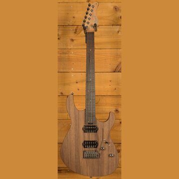 Elektrická kytara s dřevem v přirozené hnědé barvě a tmavým hmatníkem. Na hlavě je viditelné logo Cort. Nástroj má dva humbuckery, jeden ovládací kno…