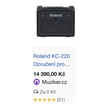 Černý kombozesilovač s mřížkou z kovového pletiva a dvěma reproduktory. Na horní části mřížky je bílý nápis Roland. Horní panel obsahuje několik ovlá…