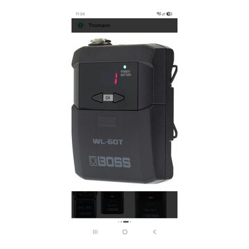 Černý bezdrátový vysílač s plastovým povrchem. Na zařízení jsou nápisy POWER/BATTERY, CH a model WL-60T spolu s logem BOSS. V horní části svítí zelen…