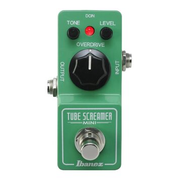 Zelený kytarový efekt s nápisy TUBE SCREAMER MINI a Ibanez. Na horní straně jsou dva černé otočné ovladače s popisky TONE a LEVEL, červená kontrolka…