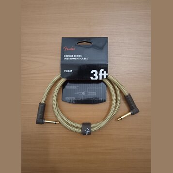 Bežový pletený instrumentální kabel s hnědými konektory a zlatými hroty. Na balení je uveden nápis Fender DELUXE SERIES INSTRUMENT CABLE, 3ft a 90CM.…
