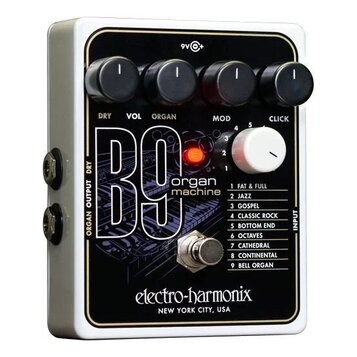 Bílý efekt pedál s černým předním panelem. Na panelu je bílý nápis B9 organ machine a logo electro-harmonix NEW YORK CITY, USA. Horní část obsahuje č…