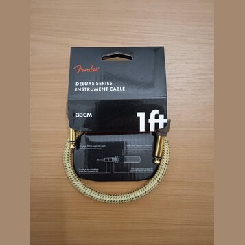 Kabel pro hudební nástroje značky Fender, model DELUXE SERIES INSTRUMENT CABLE. Kabel má délku 30CM (1ft) a je potažen světlým pleteným materiálem. J…