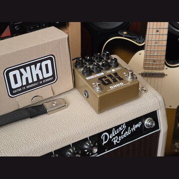 Kytarový efekt pedál zlaté barvy s nápisy GH, GREGORY KILKEN SIGNATURE a ONKO HANDBUILT IN GERMANY. Pedál má pět černých otočných knoflíků s popisky…