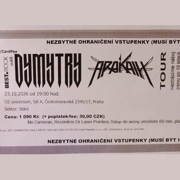 Fotografie vstupenky na koncert s nápisy DYMYTRY a ARAKAIN. Je zde uveden text BEST ROCK uvádí, TOUR neztrácíme náboj znovu po 10 letech a datum 23.1…